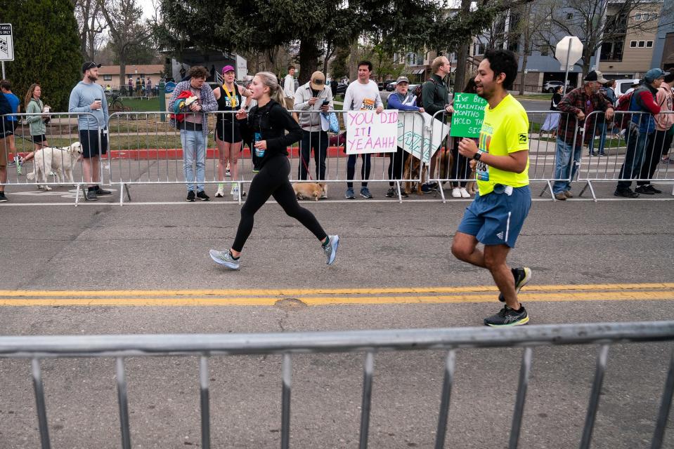 Runners come through the last stretch to the finish line during the Colorado Marathon on Sunday, May 7, 2023.