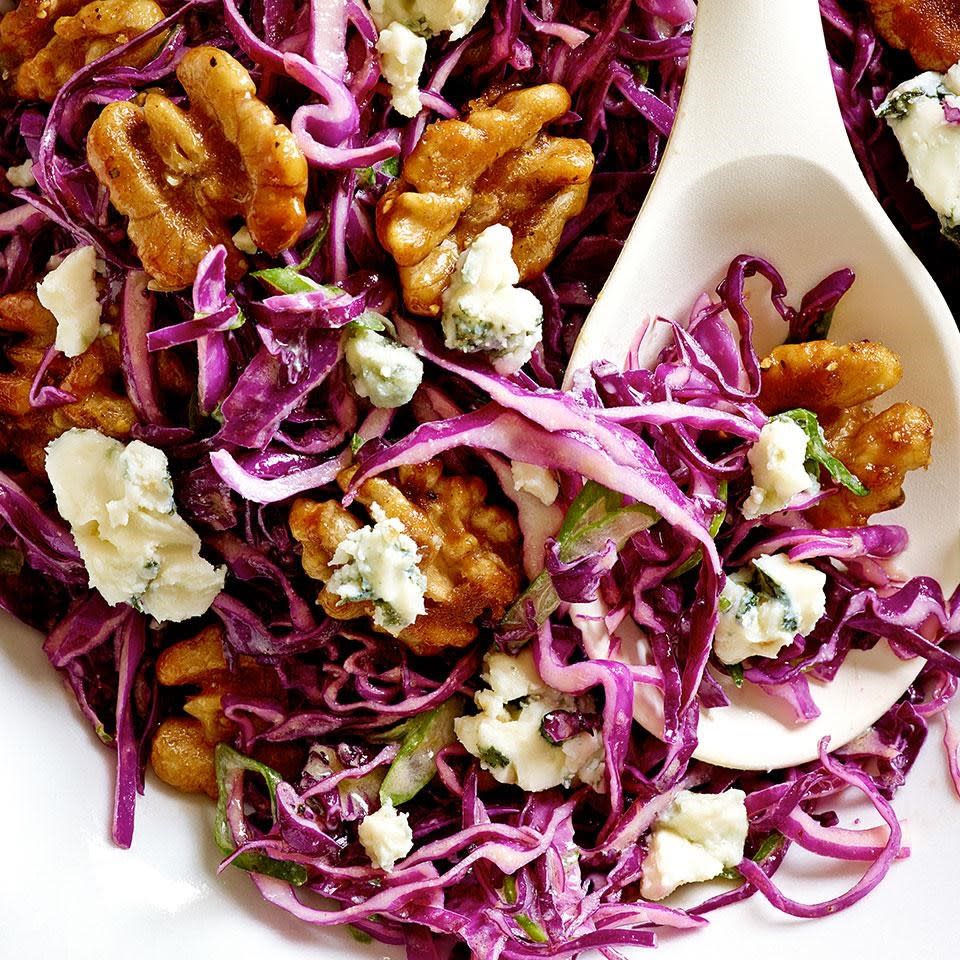 <p>Serve this hearty salad recipe--combining red cabbage, blue cheese and glazed walnuts--as an accompaniment to roast pork or chicken. To slice the cabbage quickly, cut the head into wedges and slice in your food processor. A mandoline is also a great tool for the job. <a href="https://www.eatingwell.com/recipe/252836/red-cabbage-salad-with-blue-cheese-maple-glazed-walnuts/" rel="nofollow noopener" target="_blank" data-ylk="slk:View Recipe" class="link ">View Recipe</a></p>