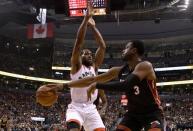 Nov 25, 2018; Toronto, Ontario, CAN; Miami Heat guard Dwyane Wade (3) passes the ball past Toronto Raptors forward Dwyane Leonard (2) in the first half at Scotiabank Arena. Mandatory Credit: Dan Hamilton-USA TODAY Sports