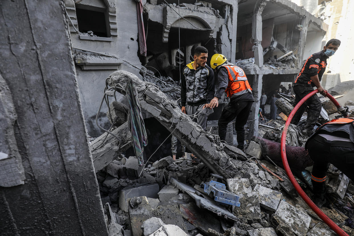 RAFAH, GAZA - OCTOBER 17: Civil defense teams and residents launch a search and rescue operation around the buildings that were destroyed after Israel's attacks on the Gaza Strip on its eleventh day in Rafah, Gaza on October 17, 2023. (Photo by Abed Rahim Khatib/Anadolu via Getty Images)