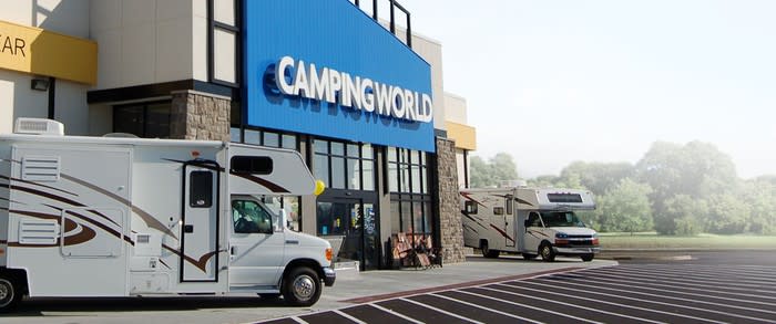 Camping World storefront with two RVs parked outside.