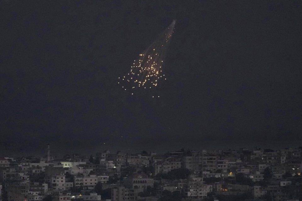 A shell from Israeli artillery explodes over Bastra Farms in the disputed Shebaa Farms territory, south Lebanon, Tuesday, Oct. 10, 2023. A Lebanese security official said six rockets were fired from southern Lebanon into northern Israel Tuesday evening. (AP Photo/Hussein Malla)