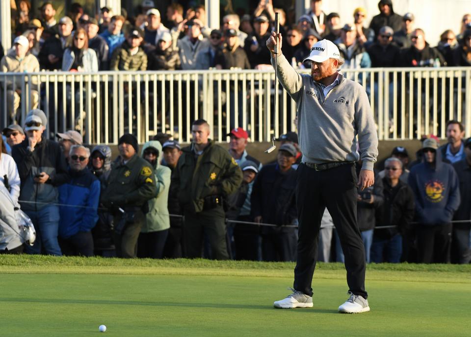 J.B. Holmes lines up a putt on the 18th hole green during the final round of the 2019 Genesis Open.