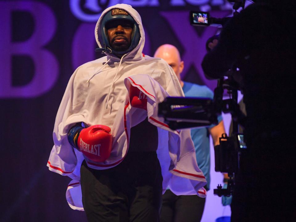 Director of School & Community Engagement of United Way Mark Cancia makes his way to the cage during the 2024 'Black Tie & Boxing' Charity Event inside Carl Perkins Civic Center in Jackson, Tenn., on Saturday, Jan. 13, 2024.