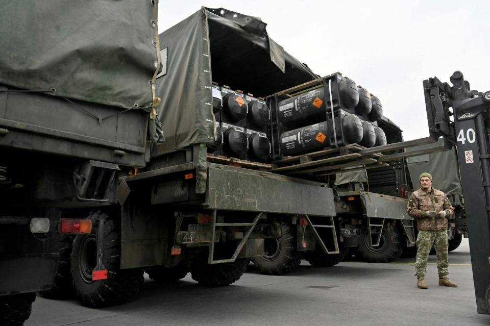 A Ukrainian serviceman loads a truck with American Javelin anti-tank missiles on Feb. 11, 2022. <a href="https://www.gettyimages.com/detail/news-photo/ukrainian-servicemen-load-a-truck-with-the-fgm-148-javelin-news-photo/1238379345?adppopup=true" rel="nofollow noopener" target="_blank" data-ylk="slk:Sergei Supinsky/AFP via Getty Images);elm:context_link;itc:0;sec:content-canvas" class="link ">Sergei Supinsky/AFP via Getty Images)</a>