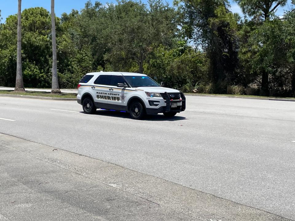 A Martin County Sheriff’s deputy drives away from Jensen Beach High School.