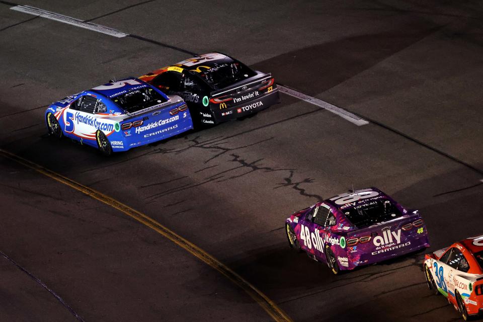 Mar 31, 2024; Richmond, Virginia, USA; NASCAR Cup Series driver Kyle Larson (5) and NASCAR Cup Series driver Bubba Wallace (23) during the Toyota Owners 400 at Richmond Raceway. Mandatory Credit: Peter Casey-USA TODAY Sports