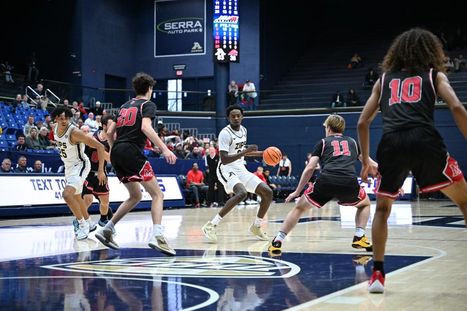 Akron Zips forwards Enrique Freeman (25) and Ali Ali (24) in action against Miami-Hamilton on Dec. 17, 2023.