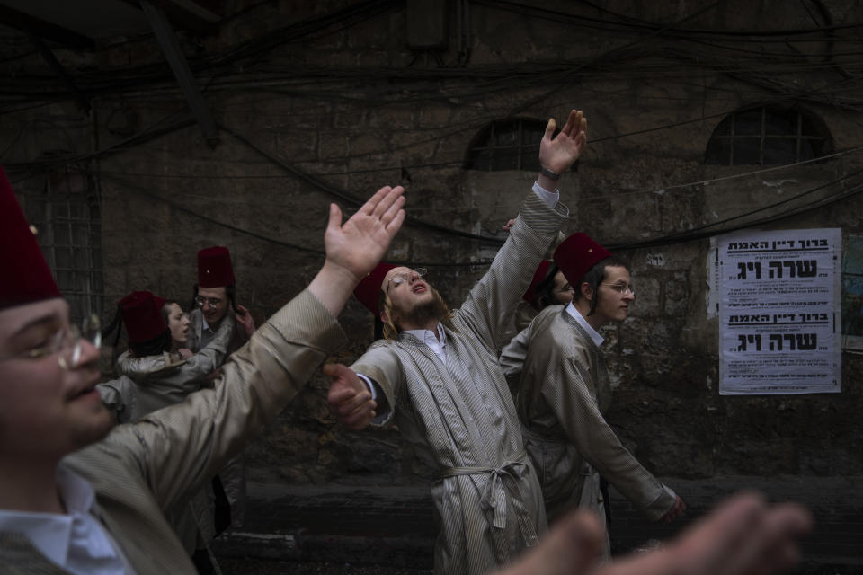 FILE - Jewish ultra-Orthodox dressed in costumes dance during the Jewish festival of Purim in Jerusalem, March 18, 2022. Purim celebrates the biblical story of how a plot to exterminate Jews in Persia was thwarted, and thus is embraced as an affirmation of Jewish survival throughout history. For many Jews, it will have extra significance in 2024 during a war in Gaza triggered by the Oct. 7, 2023, attacks on Israel in which Hamas killed 1,200 people and took about 250 others hostage. (AP Photo/Oded Balilty, File)