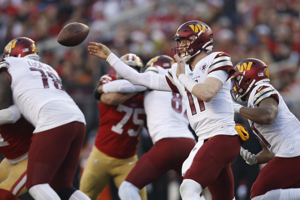 Washington Commanders quarterback Carson Wentz throws a pass in the second half of an NFL football game against the San Francisco 49ers, Saturday, Dec. 24, 2022, in Santa Clara, Calif. (AP Photo/Jed Jacobsohn)