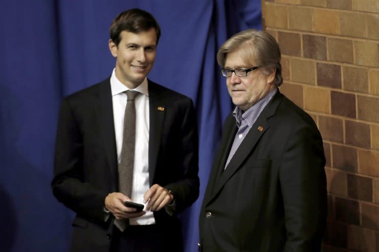 Jared Kushner and Stephen Bannon stand offstage as Donald Trump holds a campaign rally in Ohio. (Mike Segar/Reuters)