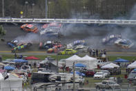 CORRECTS TO 14TH LAP, NOT 13TH AS ORIGINALLY SENT - Cars collide on the 14th lap during the NASCAR Daytona 500 auto race at Daytona International Speedway, Sunday, Feb. 14, 2021, in Daytona Beach, Fla. (AP Photo/Chris O'Meara)