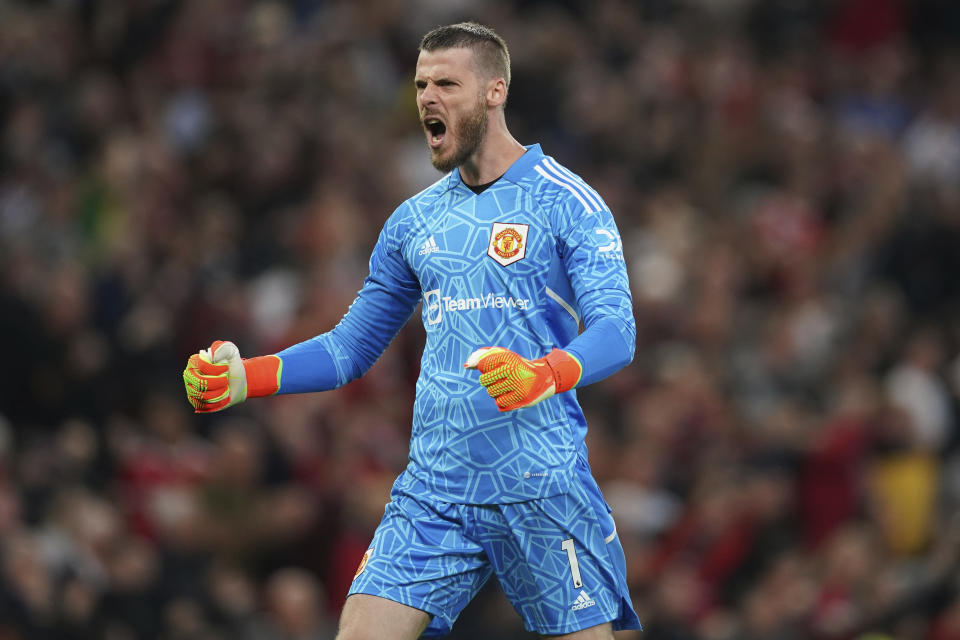 Manchester United's goalkeeper David de Gea celebrates after his teammate Jadon Sancho scored his side's first goal during the English Premier League soccer match between Manchester United and Liverpool at Old Trafford stadium, in Manchester, England, Monday, Aug 22, 2022. (AP Photo/Dave Thompson)