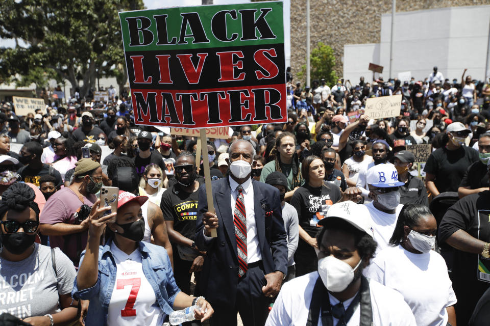 Demonstrators gather Sunday June, 7, 2020 in Compton, Calif., during a protest over the death of George Floyd who died May 25 after he was restrained by Minneapolis police. Proposed federal legislation that would radically transform the nation's criminal justice system through such changes as eliminating agencies like the Drug Enforcement Administration and the use of federal surveillance technology is set to be unveiled Tuesday, July 7, by the Movement for Black Lives. (AP Photo/Marcio Jose Sanchez, File)