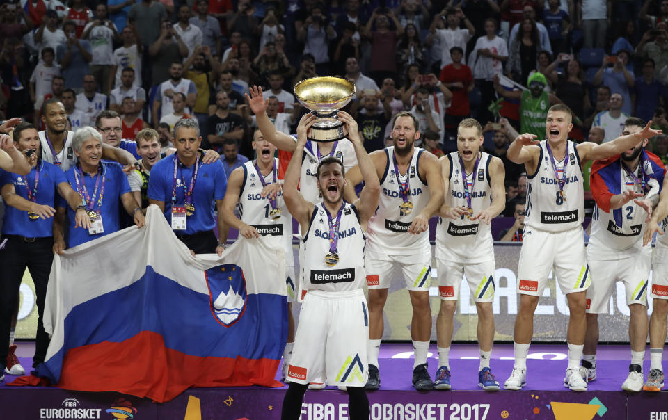 FILE - Slovenia's Goran Dragic lifts the trophy after defeating Serbia in the Eurobasket European Basketball Championship final match in Istanbul, Sunday, Sept. 17. 2017. Goran Dragic, a former All-Star guard with the Miami Heat and the leader of Slovenia’s team that won the EuroBasket championship in 2017, has announced his retirement. (AP Photo/Thanassis Stavrakis, File)