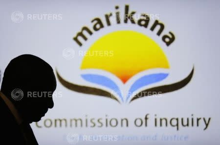 South African Deputy President Cyril Ramaphosa is silhouetted in the Farlam Commission, in Centurion, outside Pretoria August 11, 2014. Ramaphosa is facing a probe into the 2012 Marikana killings of striking miners. REUTERS/Siphiwe Sibeko