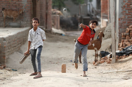 FILE PHOTO: Muslim children play cricket in village Nayabans in the northern state of Uttar Pradesh, India May 10, 2019. REUTERS/Adnan Abidi