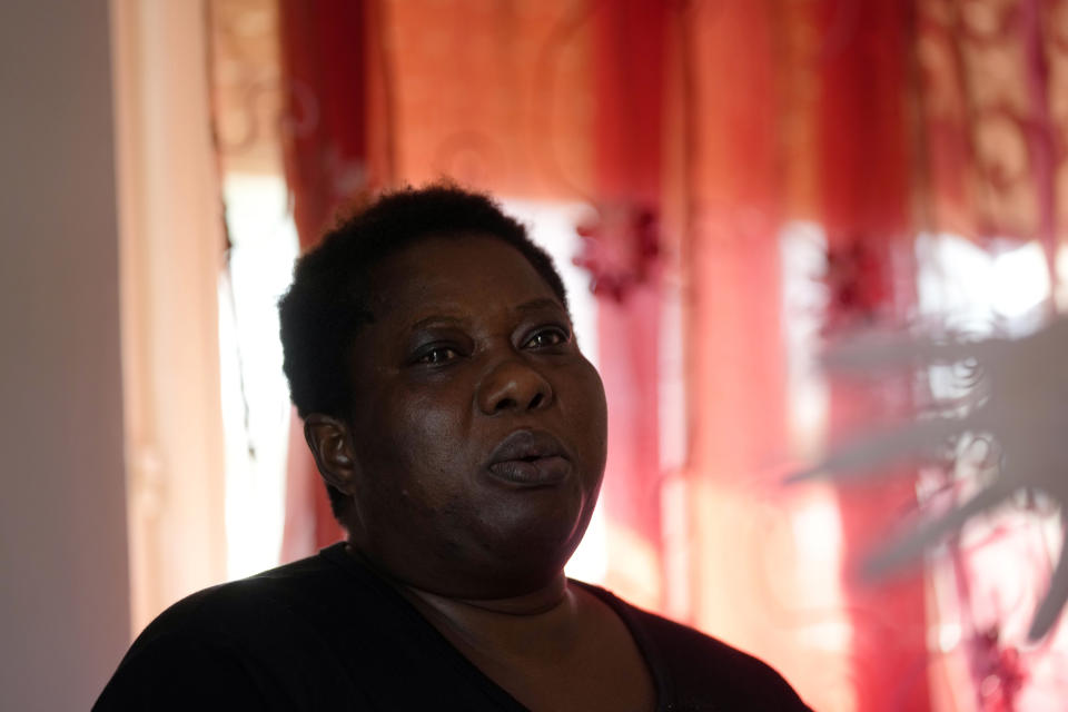 Charity Oriakhi, widow of a street vendor Alika Ogochukwu, talks with journalist during an interview with Associated Press at her home in San Severino Marche, Italy, Friday, Aug. 5, 2022. The brutal killing of a Nigerian immigrant in broad daylight has sparked a debate in this well-to-do Adriatic beach community over whether the attack by an Italian man with a court-documented history of mental illness was racially motivated. It will go to the streets on Saturday, Aug. 6 when a Black Italian activists from all over Italy march through the town demanding justice for Alika Ogorchukwu. (AP Photo/Antonio Calanni)