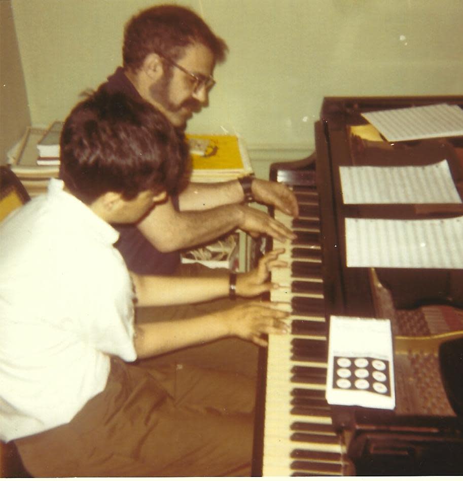 Andy Strauss (front) and John Strauss (back) at the piano in 1970 in New York, New York.