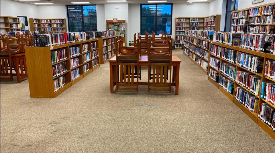 Before photo of the main collection and carpeted floors at Louis Latzer Library in Highland.