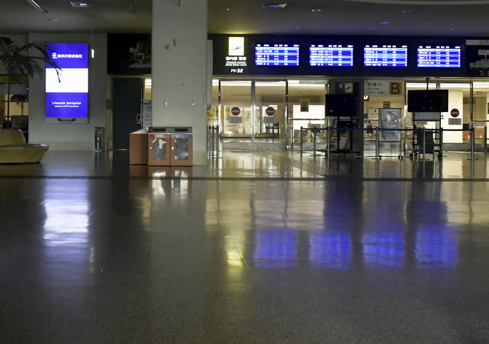 Naha airport is deserted as it is closed due to approaching typhoon in Naha, Okinawa, southern Japan, Wednesday, Aug. 1, 2023. Hundreds of flights into and out of the Naha airport, including a more than a dozen international flights connecting Seoul, Hong Kong, Taipei and Shanghai, were canceled, according to the airport. Public transportation on Okinawa, including buses and light rail transit systems in Naha, and ferries connecting Okinawa and nearby islands, were suspended.(Kyodo News via AP)