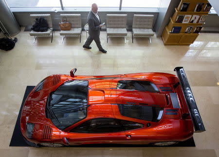 A man looks at a McLaren F-1 LM-Specification car is displayed at Sotheby's in New York June 3, 2015. REUTERS/Brendan McDermid