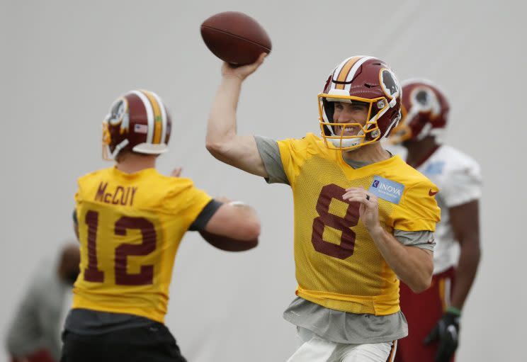 Kirk Cousins will play on the franchise tag for a second straight season. (AP)