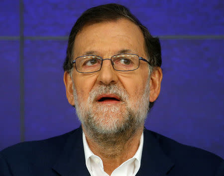 Spain's acting Prime Minister and People's Party (PP) leader Mariano Rajoy reacts as he presides over an executive committee meeting at his party headquarters in Madrid, Spain, August 17, 2016. REUTERS/Javier Barbancho