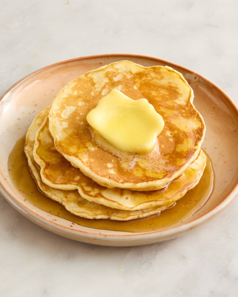 pancakes on a plate with butter and syrup