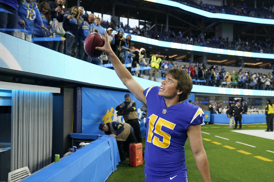 Los Angeles Chargers place kicker Cameron Dicker celebrates toward fans after kicking the game winning field goal during the second half of an NFL football game against the Tennessee Titans in Inglewood, Calif., Sunday, Dec. 18, 2022. (AP Photo/Marcio Jose Sanchez)