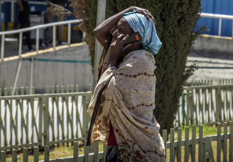 A family member of a victim involved in a plane crash talks on a mobile phone at Addis Ababa international airport, March 10, 2019. (Photo: Mulugeta Ayene/AP)