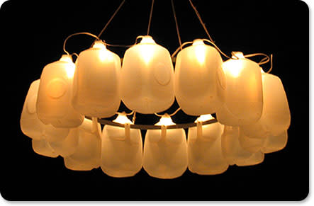 This milk jug chandelier was created with 14 milk jugs attached to a hula hoop. String lightsâ€¦