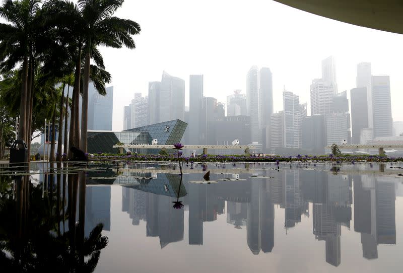 FILE PHOTO: The financial district is seen shrouded by haze in Singapore