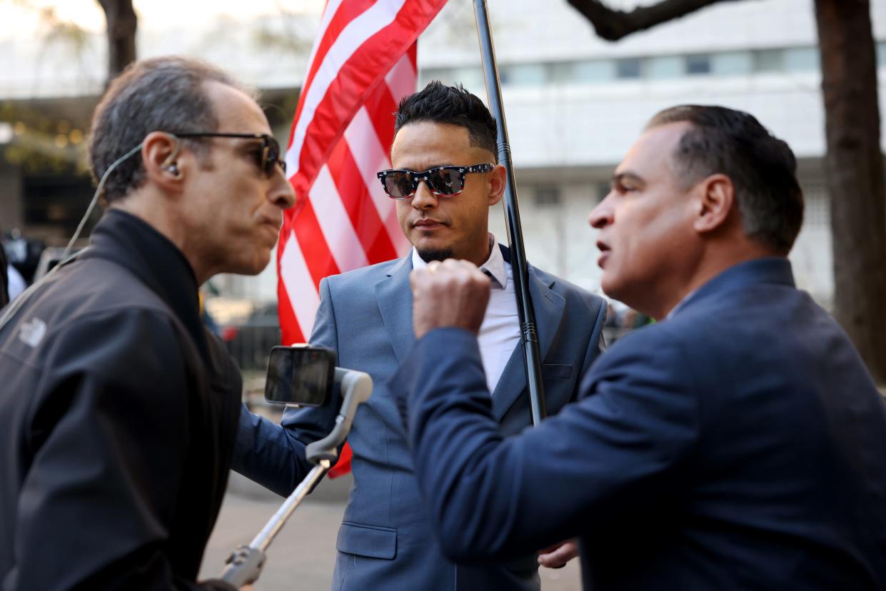 Trump supporters argue with reporters outside of the New York State Supreme Court before the arrival of former President Donald Trump on April 15, 2024 in New York City.