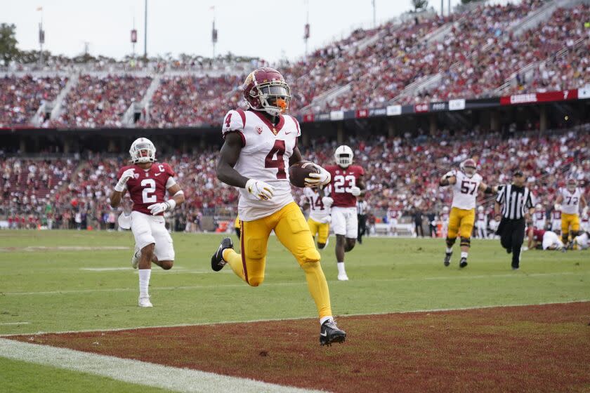 Southern California wide receiver Mario Williams (4) scores on a 15-yard touchdown reception.