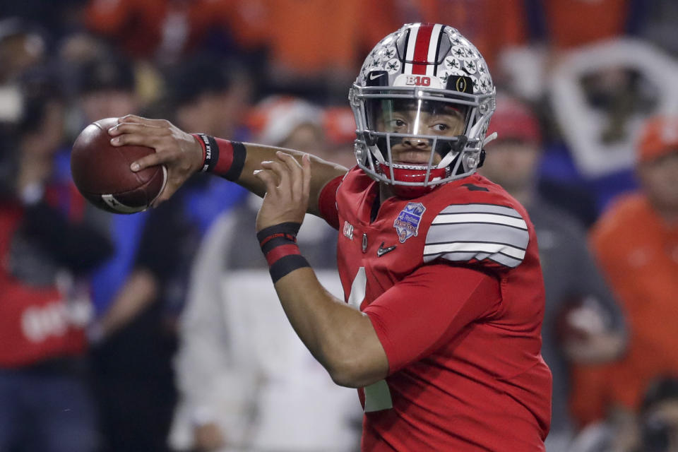 Ohio State quarterback Justin Fields throws a pass against Clemson during the first half of the Fiesta Bowl NCAA college football playoff semifinal Saturday, Dec. 28, 2019, in Glendale, Ariz. (AP Photo/Rick Scuteri)