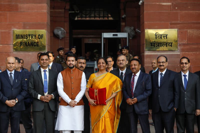 India's Finance Minister Nirmala Sitharaman holds budget papers during a photo opportunity as she leaves her office to present the federal budget in the parliament in New Delhi