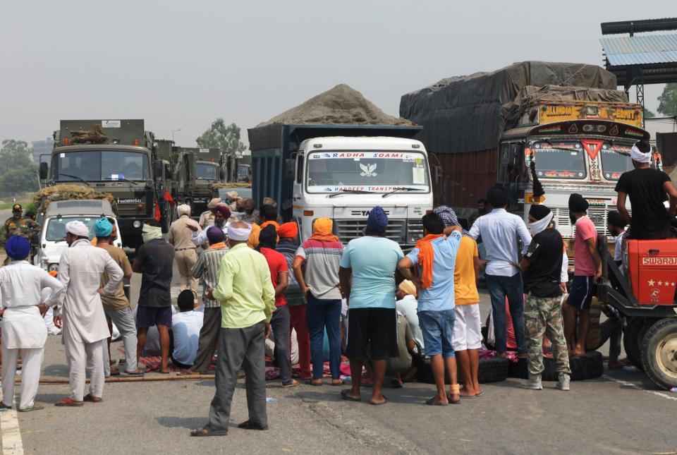 Farmers block a national highway during a nationwide farmers' strike following the recent passing of agriculture bills in the Lok Sabha (lower house), on the outskirts of Amritsar on September 25, 2020. (Photo by NARINDER NANU/AFP via Getty Images)