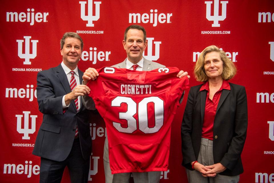 Vice President and Director of Intercollegiate Athletics Scott Dolson, left, Indiana's newly announced head coach of football Curt Cignetti, middle, and Indiana Univeristy President Pamela Whitten pose together on Friday, Dec. 1, 2023. Cignetti is the 30th football coach in the university's history.