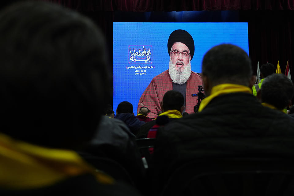 Supporters of the Iranian-backed Hezbollah group listen to a speech by Hezbollah leader Sayyed Hassan Nasrallah via a video link, during a rally to mark the "Wounded Resistance Day," in the southern Beirut suburb of Dahiyeh, Lebanon, Monday, March 6, 2023. The leader of Lebanon’s militant Hezbollah group said Monday that they back former Cabinet minister and strong ally Sleiman Frangieh to become Lebanon’s next president. (AP Photo/Bilal Hussein)