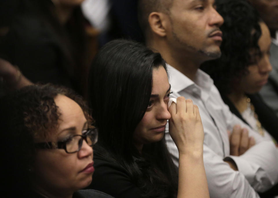 Members of one of the victim's family are tearful during the double murder trial for former New England Patriots tight end Aaron Hernandez at Suffolk Superior Court, Thursday, April 6, 2017, in Boston. Hernandez is on trial for the July 2012 killings of Daniel de Abreu and Safiro Furtado who he encountered in a Boston nightclub. The former NFL player is already serving a life sentence in the 2013 killing of semi-professional football player Odin Lloyd. (AP Photo/Steven Senne, Pool)