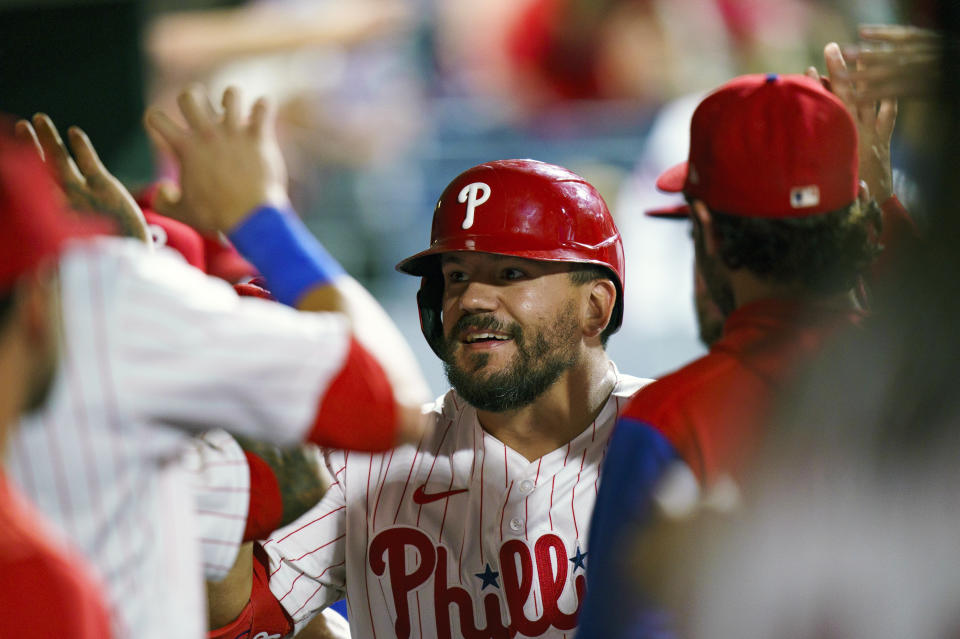 Philadelphia Phillies' Kyle Schwarber celebrates his home run with teammates during the eighth inning of a baseball game against the Washington Nationals, Saturday, Sept. 10, 2022, in Philadelphia. The Phillies won 8-5. (AP Photo/Chris Szagola)