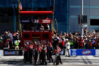 LAS VEGAS, NV - MARCH 11: The crew of Tony Stewart, driver of the #14 Mobil 1/Office Depot Chevrolet, celebrates after Stewart won the NASCAR Sprint Cup Series Kobalt Tools 400 at Las Vegas Motor Speedway on March 11, 2012 in Las Vegas, Nevada. (Photo by Tom Pennington/Getty Images)