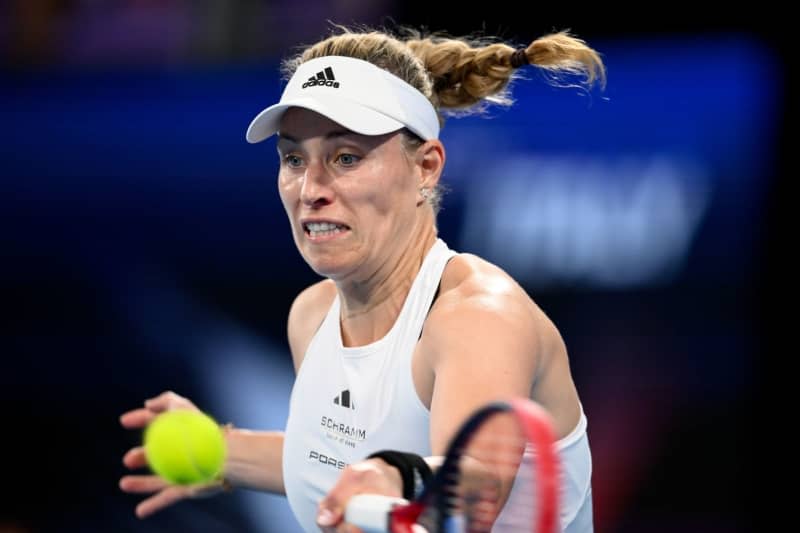 German tennis player Angelique Kerber in action against Italy's Jasmine Paolini during the Group D women's tennis match of the 2024 United Cup at Ken Rosewall Arena in Sydney. Steven Markham/AAP/dpa
