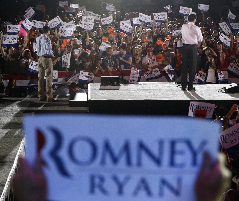 Republican presidential candidate and former Massachusetts Gov. Mitt Romney campaigns with vice presidential candidate Rep. Paul Ryan in Fishersville, Va., Thursday, Oct. 4, 2012. (AP Photo/Charles Dharapak)