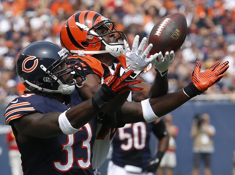 Cincinnati Bengals' Andrew Hawkins makes a catch against Chicago Bears' Charles Tillman during the first quarter of their NFL football game in Chicago, Illinois