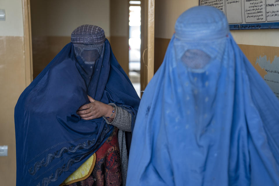 Mothers along with babies who suffer from malnutrition wait to receive help and check-up at a clinic that run by the WFP, in Kabul, Afghanistan, Thursday, Jan. 26, 2023. A spokesman for the U.N. food agency says malnutrition rates in Afghanistan are at record highs. Aid agencies have been providing food, education, healthcare and other critical support to people, but distribution has been severely impacted by a Taliban edict banning women from working at national and international nongovernmental groups. (AP Photo/Ebrahim Noroozi)