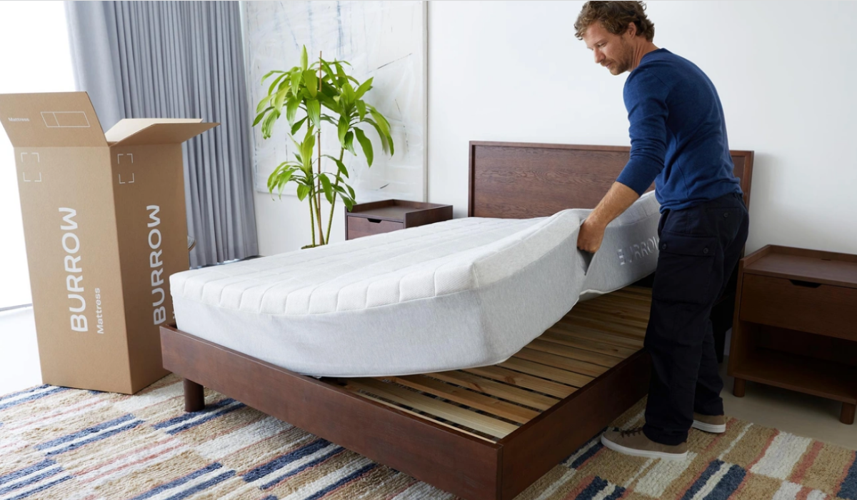 Man setting up mattress