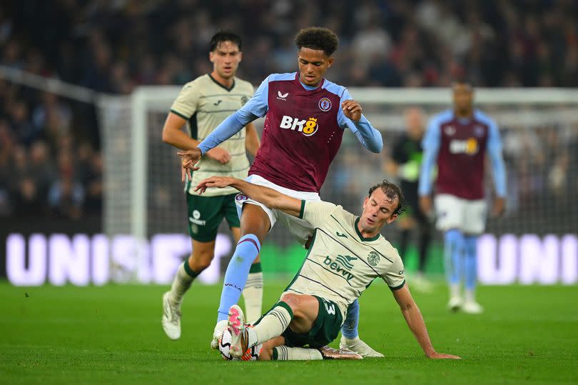 Omari Kellyman of Aston Villa is tackled by Christian Doidge of Hibernian during the UEFA Conference League Qualifying Play-Offs: Second Leg match between Aston Villa and Hibernian