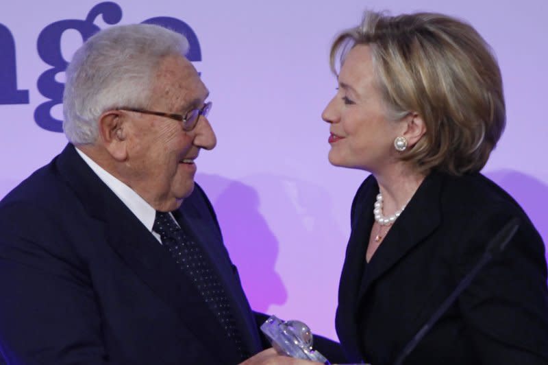Former U.S. Secretary of States Dr. Henry Kissinger (L) and Hillary Clinton display the Freedom Award during the Freedom Challenge Dinner in Berlin on November 8, 2009. Clinton received the award which recognizes individuals who have fought for democracy and liberty. The event was held in conjunction with the 20th anniversary of the fall of the Berlin Wall. File photo by David Silpa/UPI